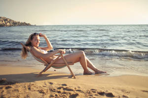 Bikini Woman In Folding Chair Wallpaper