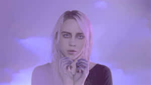 Billie Eilish Rocks A Bold Purple Look Wallpaper