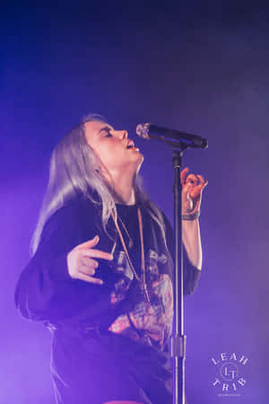 Billie Eilish Walks Through A Purple Wonderland Wallpaper