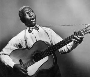 Black American Folk Singer Leadbelly Vintage Photograph Wallpaper