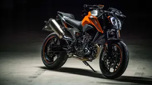 Black And Orange 4k Bike Wallpaper