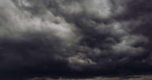 Black And White Clouds Intersecting In The Sky Wallpaper