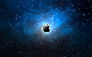 Black Apple Logo Against A Blue Galaxy Wallpaper