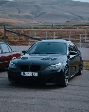 Black Bmw M5 At Racing Track Wallpaper