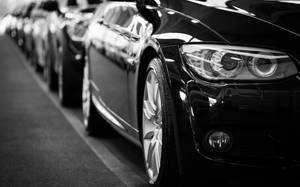 Black Cars Lined Up In Parking Space Wallpaper