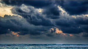 Black Clouds Above The Ocean Wallpaper