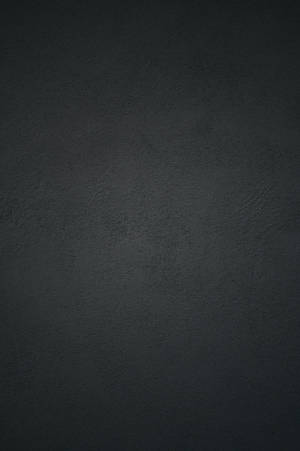 Black Concrete Wall Background With A Light Reflection Wallpaper