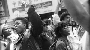 Black Gay Man Participating In Pride Parade 1991 Wallpaper