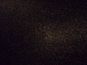 Black Glitter Subtle Gold Glow Wallpaper