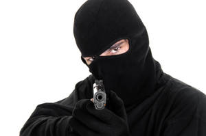 Black Ski Mask Holding A Gun Wallpaper