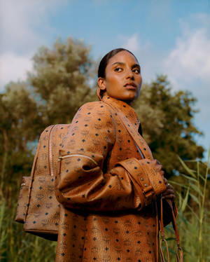 Black Woman Dressed In Mcm Wallpaper