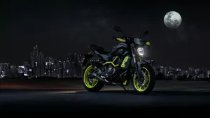 Black Yamaha Mt 15 Against Big Moon Wallpaper
