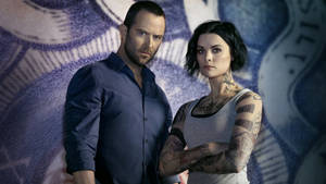 Blindspot Stars Jamie Alexander And Sullivan Stapleton Poster Wallpaper