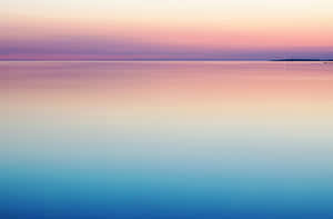 Blue And Purple Sunset With Calm Waters Wallpaper