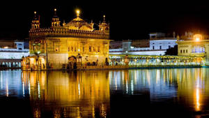 Blue And Yellow Lights On Golden Temple Hd Wallpaper