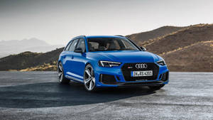 Blue Audi Rs In The Mountains Wallpaper