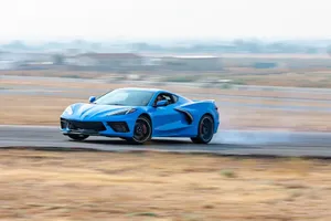 Blue Corvette C8 Speedingon Track.jpg Wallpaper