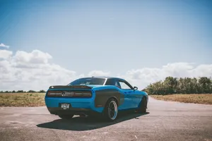 Blue Dodge Challenger Parked Outdoors Wallpaper
