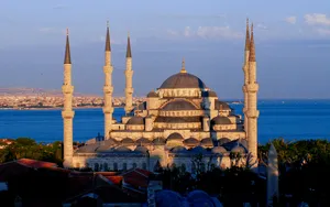 Blue Mosque Against Blue Ocean Wallpaper