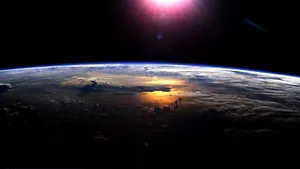 Blue Planet Brightly Lit By The Sun Wallpaper