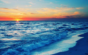 Blue Waves On Beach Sunset Wallpaper