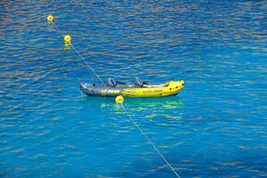 Boat In Transparent Sea Wallpaper