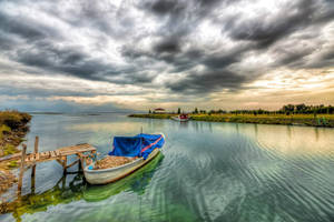 Boat Moored On A Lake Wallpaper