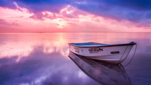 Boat Reflection In Sea Water Wallpaper