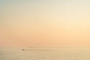 Boat Silhouette In The Horizon Wallpaper