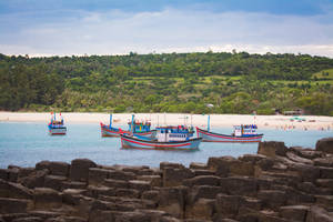 Boat With Sea Stacks At The Side Wallpaper