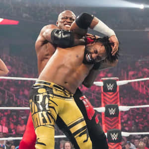 Bobby Lashley Versus Cedric Alexander In Wwe Raw Wallpaper