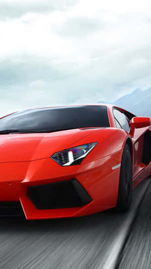 Bold Red Car In The Modern Landscape Wallpaper