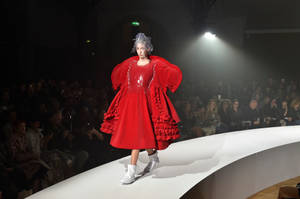 Bold Red Puffed Dress By Comme Des Garçons Wallpaper