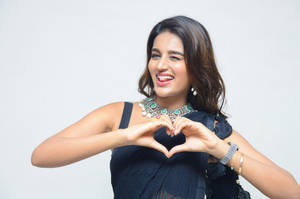 Bollywood Actress Nidhi Agarwal At The Ismart Shankar Movie Pre-release Event Wallpaper