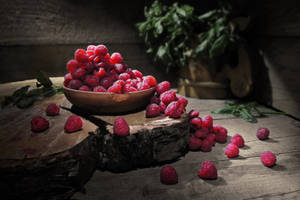 Bowl Of Spilled Raspberries Wallpaper