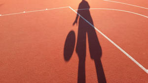 Boy Shadow In A Basketball Court Wallpaper