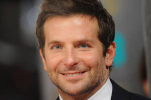 Bradley Cooper Smiling Back At Camera Wallpaper