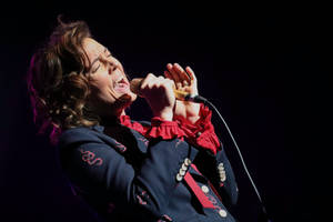 Brandi Carlile Passionate Performance Wallpaper