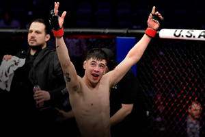 Brandon Moreno Points Up Victory Wallpaper