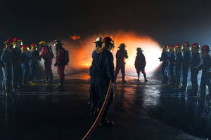 Bravery At Work: Firefighters During A Fire Drill Wallpaper