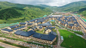 Breathtaking Aerial View Of A Snowy Ski Resort Wallpaper