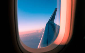 Breathtaking Sky View From The Airplane Window Wallpaper