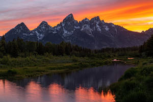 Breathtaking Sunset Over Grand Teton National Park Wallpaper