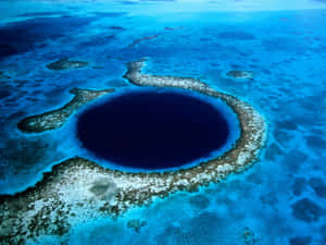 Breathtaking View Of The Great Blue Hole, Belize Wallpaper