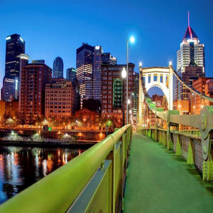 Breathtaking View Of The Green Bridge In Pittsburgh Wallpaper