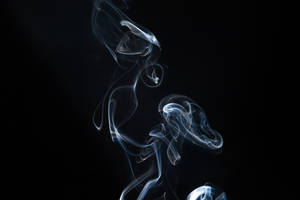 Breathtaking White Smoke Flowing Through The Air Wallpaper