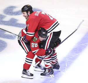 Brent Seabrook And Patrick Kane Celebrating On The Ice Wallpaper