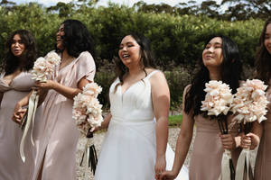 Bride And Bridesmaids Holding Hands Wallpaper