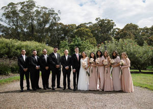 Bridesmaids With Newlywed Couple Wallpaper