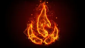 Bright And Beautiful Flame Dancing Across A Darkened Sky Wallpaper